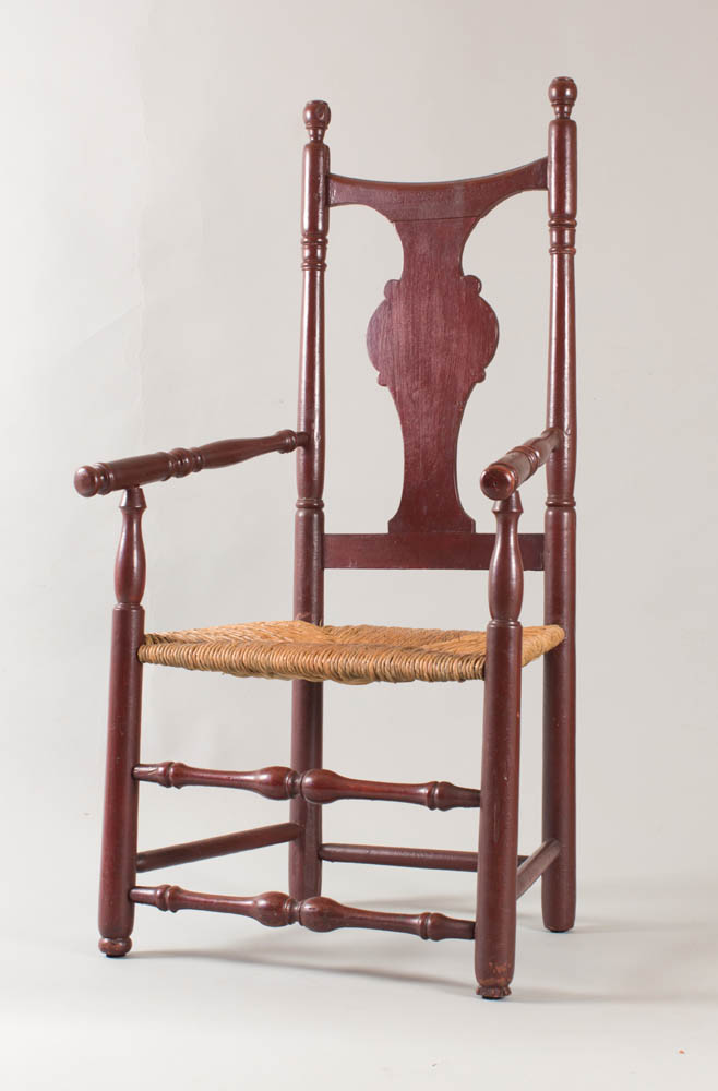 A great country Queen Anne armchair in old dark red paint over original red