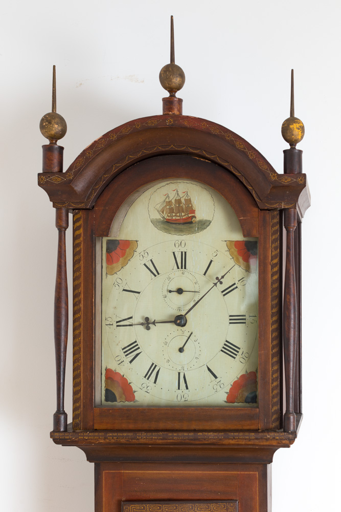 An exceptional painted cased wooden works tall clock