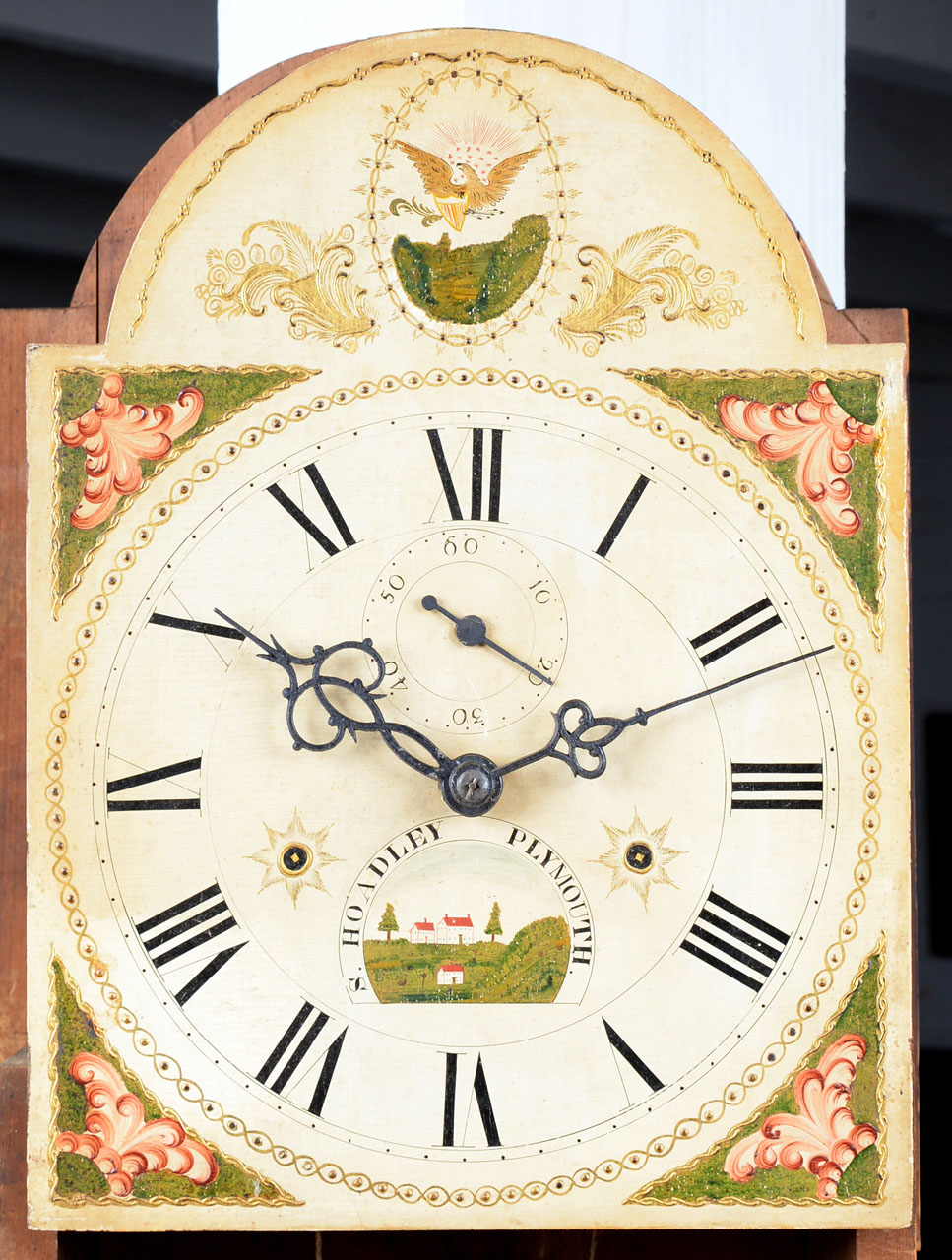 A paint-decorated tall clock detail