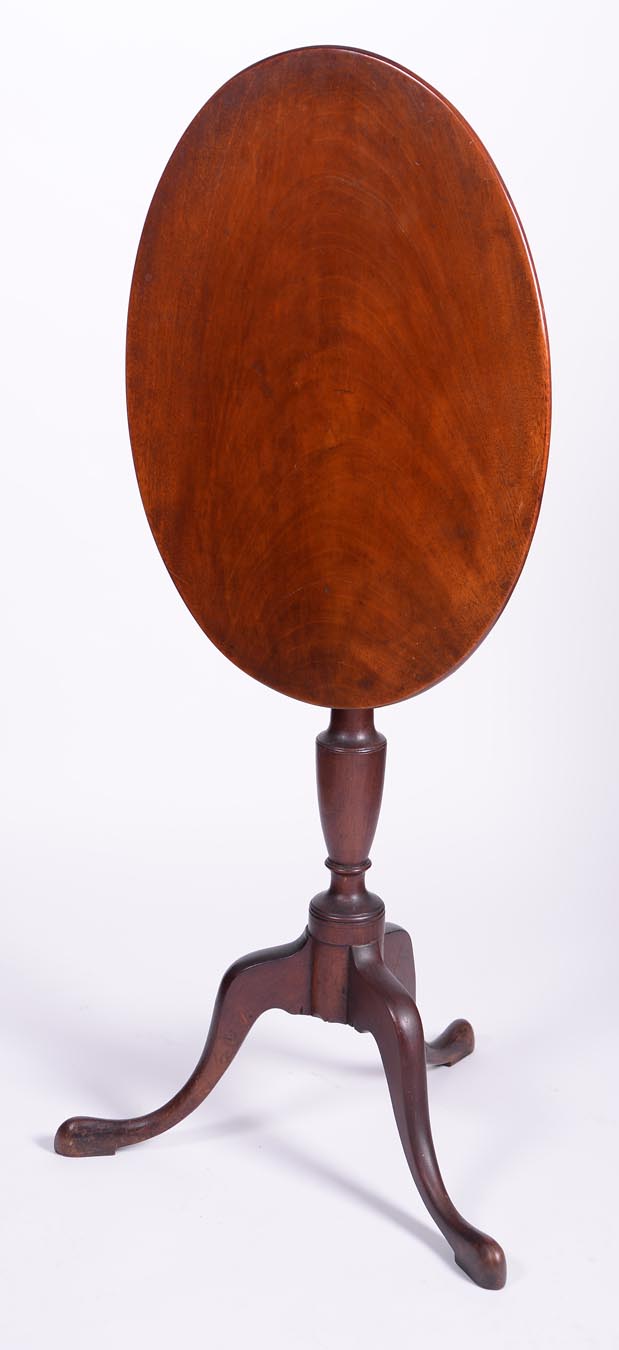 An exceptional formal Queen Anne candlestand with oval top