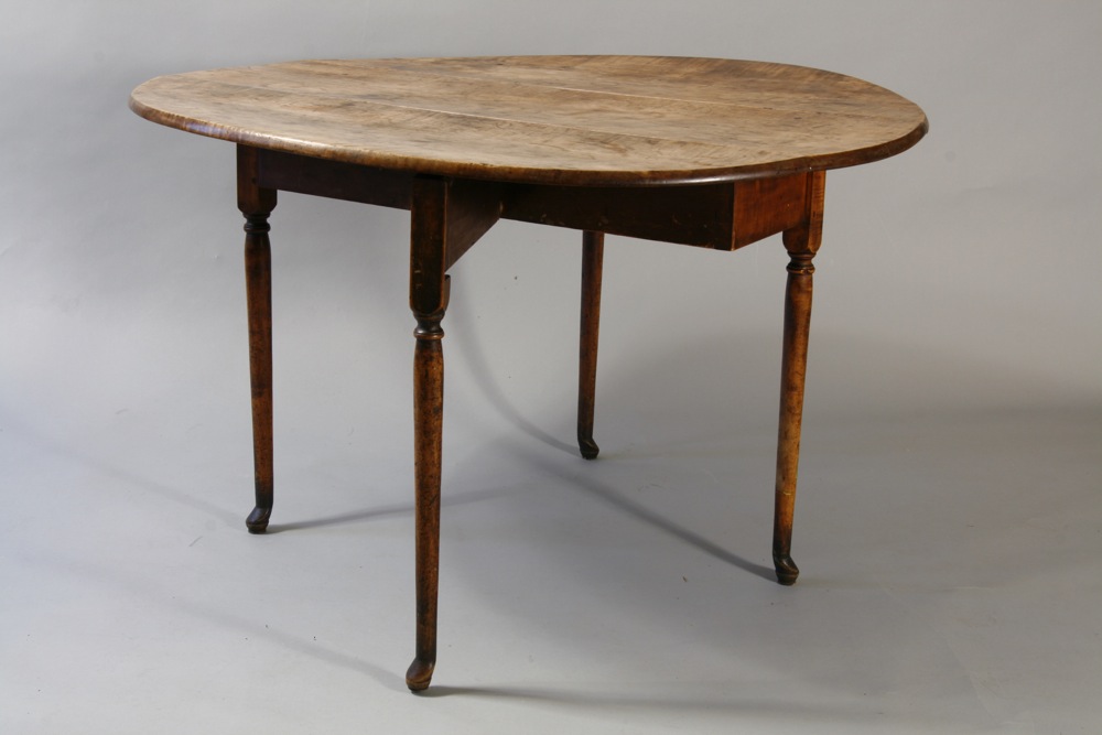 A very fine and unusual Queen Anne drop leaf table