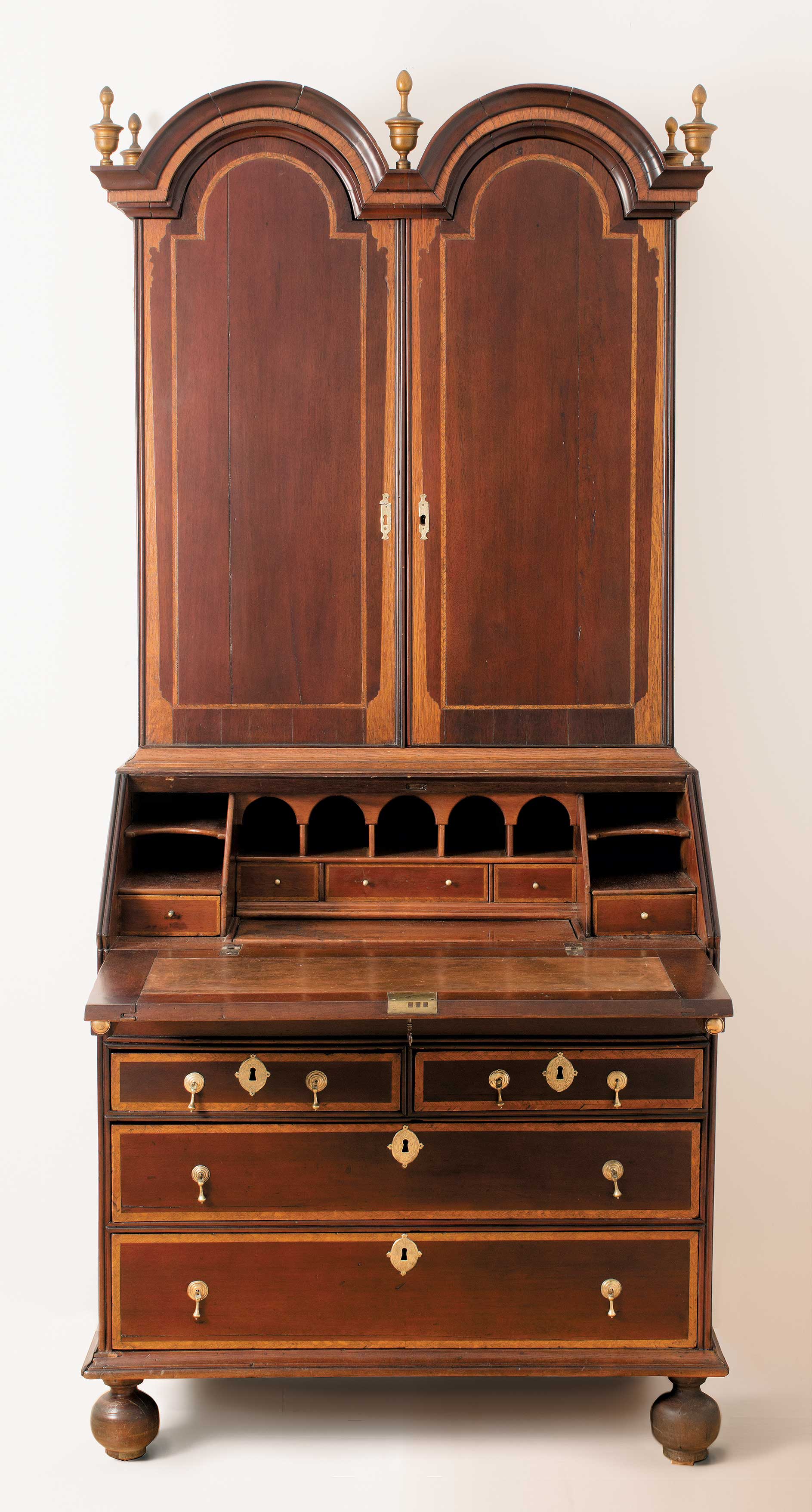 A very rare William and Mary period ball-footed desk/bookcase