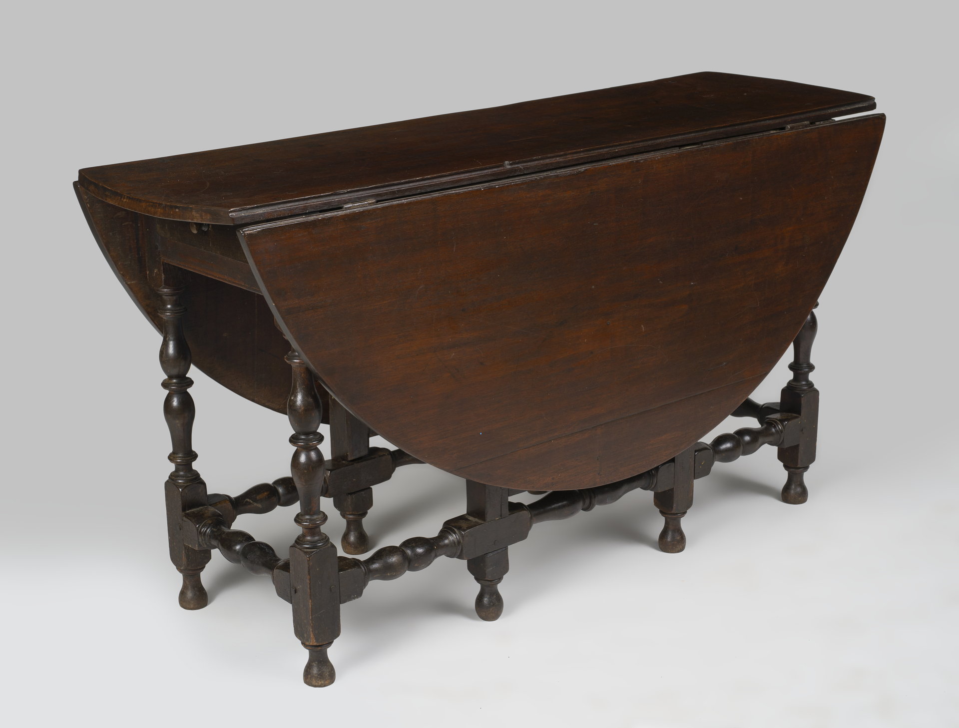 An exceptionally fine William and Mary gate-legged table in a rare large size.
