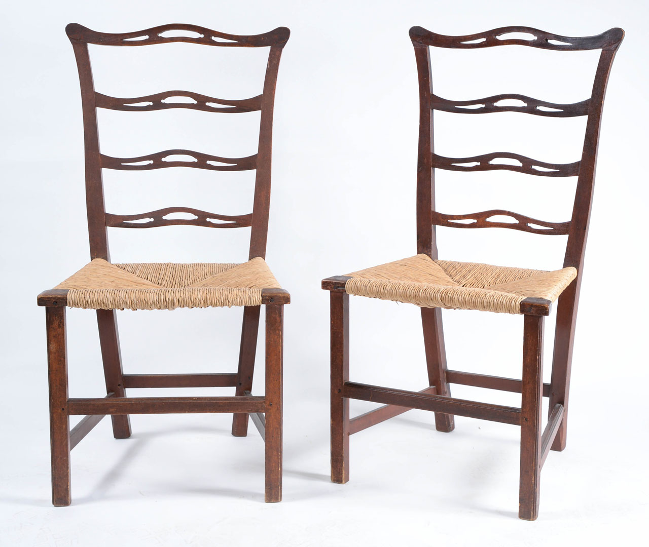 A fine pair of Chippendale 'ribbon-back' chairs.