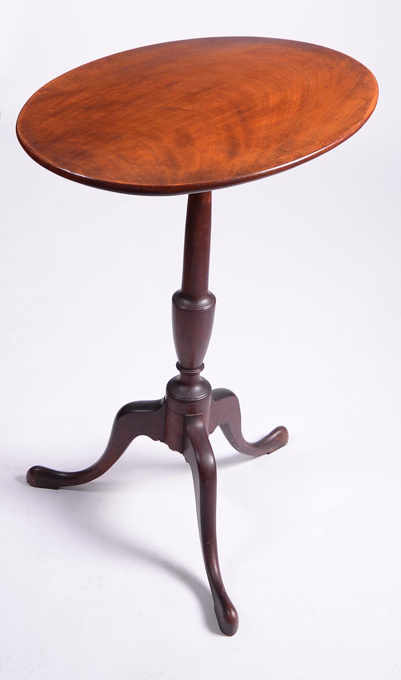 An exceptional formal Queen Anne candlestand with oval top